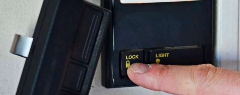 where is the lock button on garage door opener